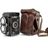 ROLLEIFLEX; a 2.8f 120 film camera, serial no. 2442974, with branded leather carry case, fitted with