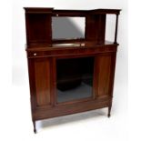 An Edwardian inlaid mirror back display cabinet with galleried top above single glazed door, on