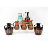 Seven Etruscan-style vases to include a pair of twin-handled black ground baluster vases, three