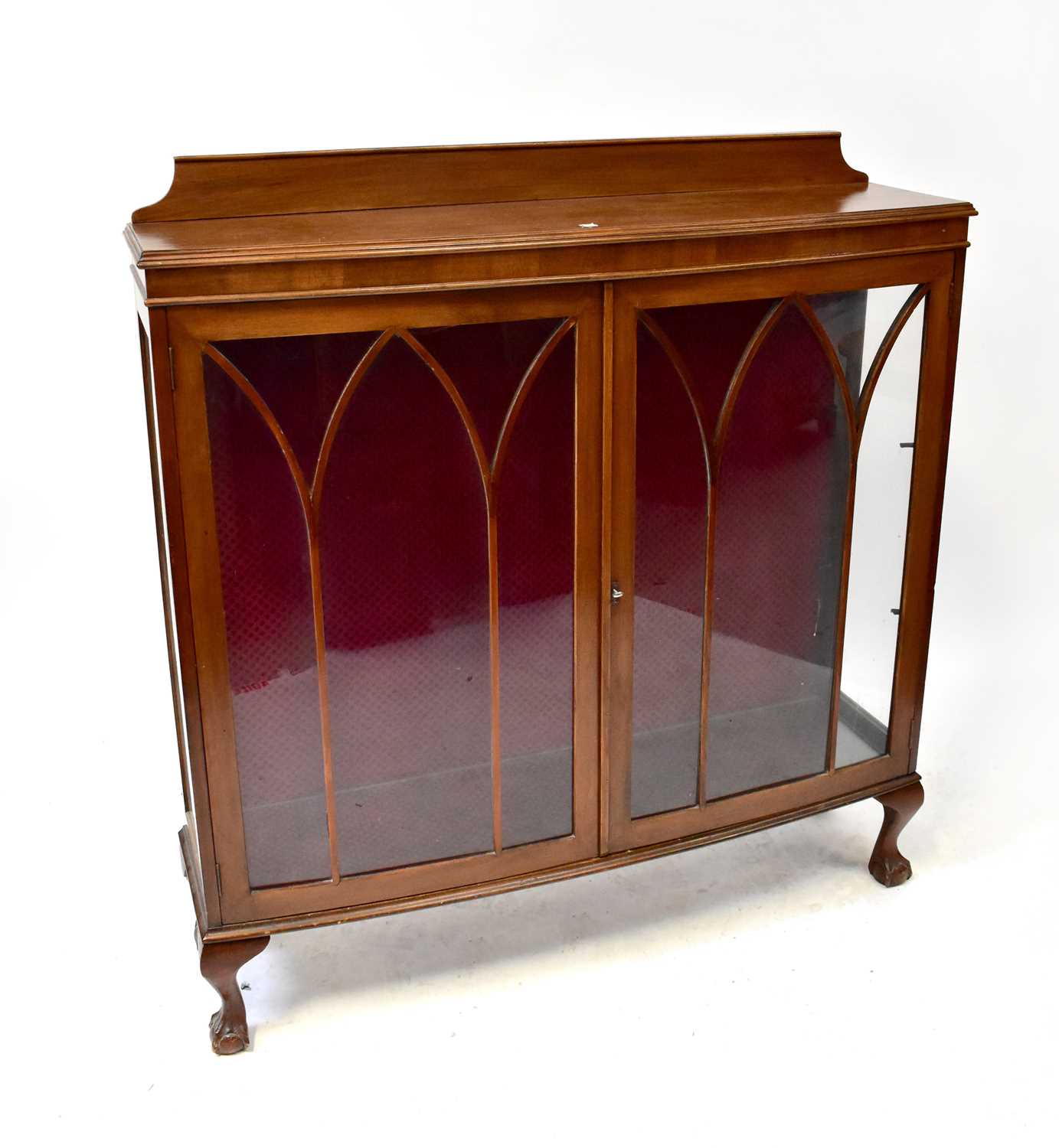 A mid-20th century mahogany display cabinet with twin astragal glazed doors, to paw supports, 118