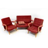 G-PLAN; a mid-20th century three-piece suite comprising a two-seat sofa and two matching