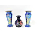 MOORCROFT; a baluster vase, cobalt blue ground with tube-lined anemone pattern decoration, with