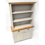 A modern dresser with three-shelf top on a base of two drawers and two cupboards, wood-effect and