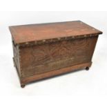 A 20th century mahogany chest with brass floral inlay to the top, carved trellis design to the