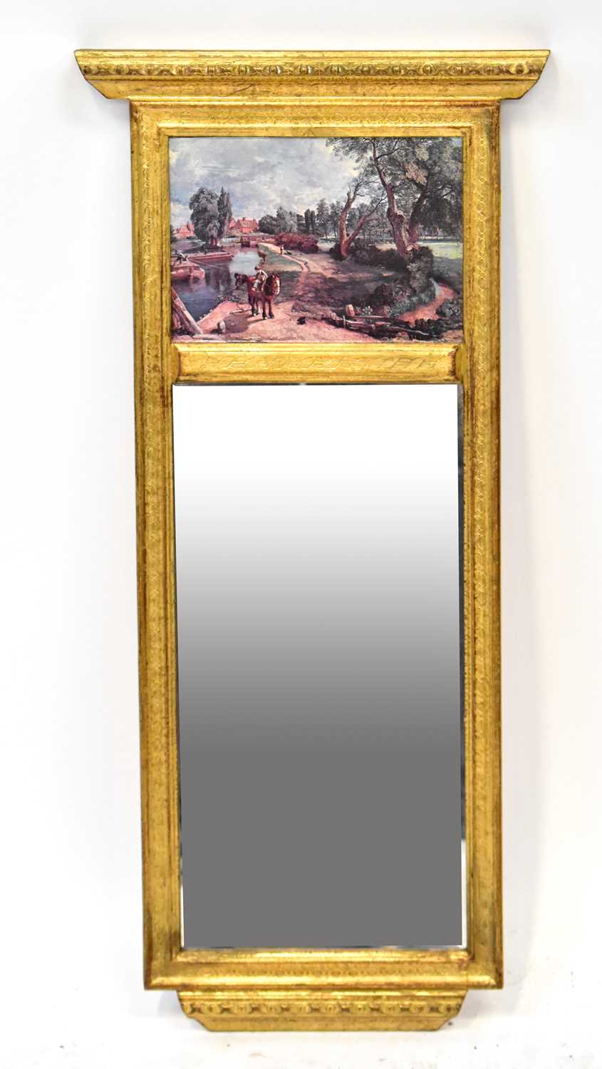 A gilt wood pier mirror, the top panel decorated with a printed Constable scene, 85 x 40cm.