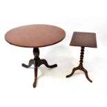 A 19th century mahogany tilt-top circular table, with vase column on three splayed feet, 72 x