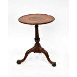 A 19th century circular table with lipped top on dun barrel column and tripod cabriole legs, 63 x