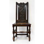 A Georgian oak joint chair with floral carved backrest, on block and turned legs, height 99cm.