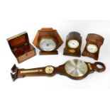 An Edwardian inlaid mahogany mantel clock, the enamelled dial set with Arabic numerals, an Art