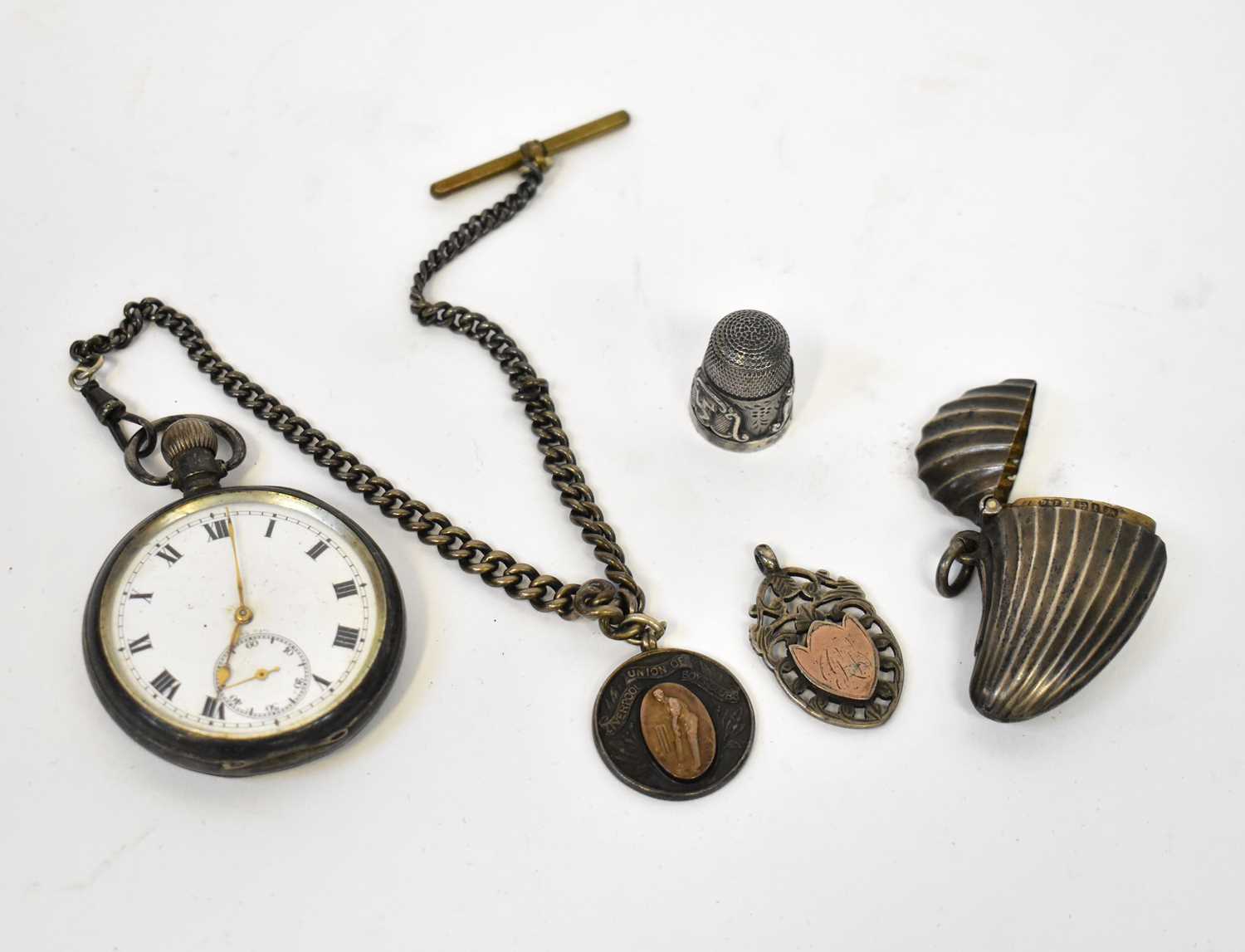 A silver open face crown wind pocket watch with chain and fob, a silver vesta case in the form of