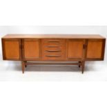 G-PLAN; a 1960s/70s teak sideboard with central bank of four drawers flanked by double cabinets,