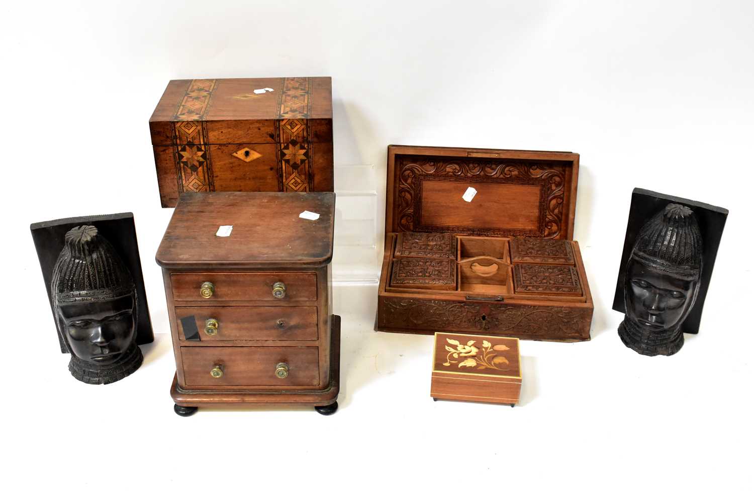A group of late 19th/early 20th century treen to include a small mahogany table-top three-drawer