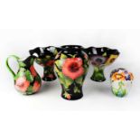 Five Blue Sky Ceramics items in the manner of Moorcroft, comprising a pair of footed bowls with