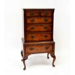 BURTON REPRODUCTIONS LIMITED; a reproduction walnut chest on stand of small proportions, the upper