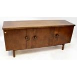 ILSE TÖYRYLÄ FOR ASKO; a Finnish 'Odessa Series' walnut sideboard with three panelled doors,