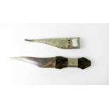 A mid-20th century Middle Eastern shibriya ceremonial dagger, the sheath with incised decoration and