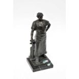 An early 19th century bronze figure of a blacksmith to stepped marble base, height 41cm.