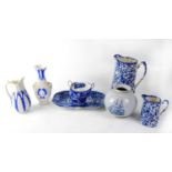 A quantity of blue and white ceramics to include graduated Willow pattern meat plates, dinner