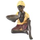 A 19th century cold painted bronze figure of an African boy holding a bowl, height 12.5cm.