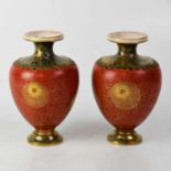 A pair of late 19th century Aesthetic movement vases, gilt-heightened decoration on a red ground,