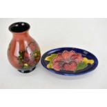 MOORCROFT; a small vase of baluster shape, with tube-lined pansies on a pink ground, height 9.5cm,