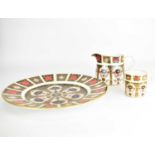 ROYAL CROWN DERBY; three items of 1128 pattern porcelain decorated in the Imari pattern,