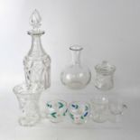 A quantity of cut and pressed glass to include various drinking glasses, decanters, dishes, table