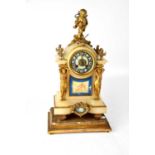 An early 20th century alabaster and ormolu style 'Papillion' eight-day mantel clock with gilded