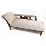 An Edwardian mahogany chaise longue upholstered in grey velour, on turned legs to castors, 73 x