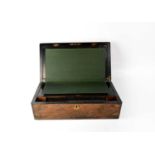 A Victorian burr walnut brass bound writing slope with fitted interior, the top with inset brass