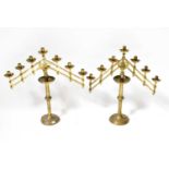 A pair of 19th century ecclesiastical brass altar candlesticks with adjustable branches holding