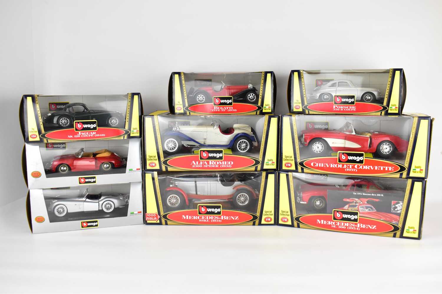 BURAGO; nine diecast scale model boxed vehicles comprising Porsche 356 Coupe, Bugatti Type 55, Alpha