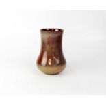 ROYAL LANCASTRIAN; a bulbous based vase with burgundy and cream/brown mottled glaze, printed marks