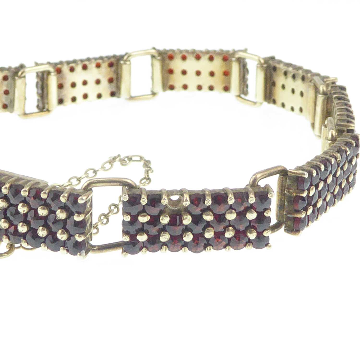A Continental gilt silver (835 grade) garnet cluster bracelet comprising ten panels of twenty-one - Image 3 of 3