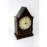 A Regency rosewood and brass inlaid lancet-shaped twin fusee bracket clock, the white enamelled dial