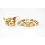 ROYAL CROWN DERBY; an 1128 pattern Imari decorated miniature cabinet cup and saucer, height of cup