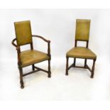 A set of six oak reproduction leather upholstered chairs with studded rim, leather back on
