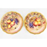 A pair of late 20th century cabinet plates decorated by former Royal Worcester artist G. Delaney,