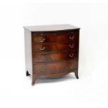 A reproduction mahogany chest of four drawers with shirt slide and glass top, on outswept feet, 80 x