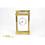 BATTY & SONS, PARIS; a brass cased carriage clock, the white enamelled dial set with Roman numerals,