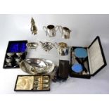 A quantity of silver plated ware to include a cased set of four salts, a cased hairbrush set, a