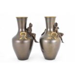 A pair of 20th century bronze vases with inserts to the top, the body with Classical maidens and