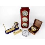 A wall-mounted three-dial set comprising a clock, hygrometer and thermometer, in a mahogany case,