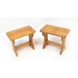 A pair of oak refectory-style stools with stretchered supports, each 44 x 51 x 30cm (2).