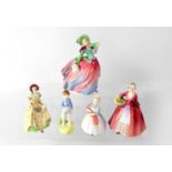 ROYAL DOULTON; a group of four figures comprising HN2045 'She Loves Me Not', HN1911 'Autumn