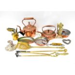 A quantity of mixed copper and brassware to include fire irons, kettles, spirit kettle, together