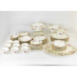 ROYAL WORCESTER; a seventy-five piece dinner service to include dinner plates, side plates, cups,