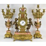 IMPERIAL; an early/mid-20th century clock garniture, the gilt metal lyre body of the clock with
