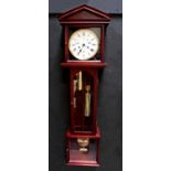W. M. WIDDOP; a modern mahogany cased wall clock in the form of a longcase clock of small