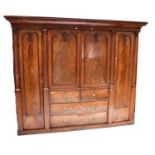 A large Victorian mahogany wardrobe comprising a central hanging compartment with two short and